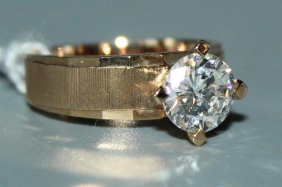 A diamond solitaire ring, 18ct gold modernist setting